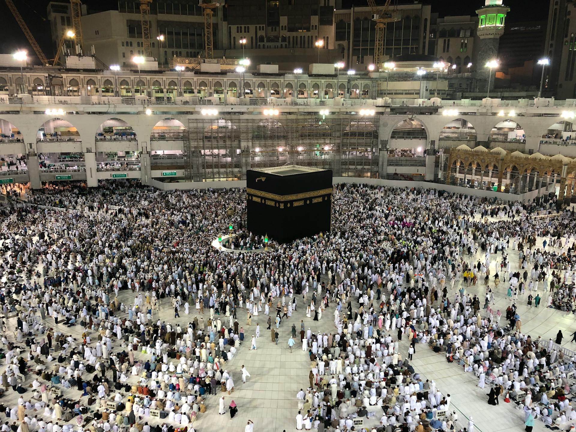 Pilgrim performing Umrah at night around the Kaaba in Makkah